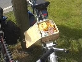 James demonstrates the lunch basket he bought at Lynmouth while we stop for a map check at Indicott, Hewish Down, Muddiford, 20.5 miles into the ride